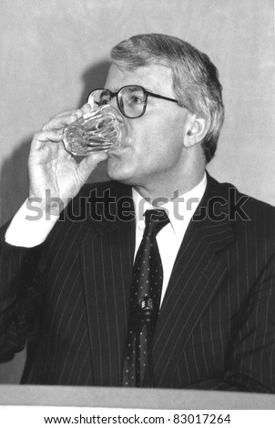 LONDON, ENGLAND - MARCH 20: Rt.Hon. John Major, British Prime Minister, drinks a glass of water during a press conference on March 20, 1992 in London.