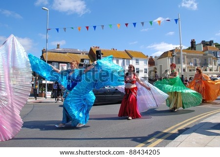 HASTINGS, ENGLAND - JULY 30: The Iceni Tribal Dancers perform at a parade during the Old Town Carnival Week on July 30, 2011 in Hastings, East Sussex, England. The carnival was founded in 1968.