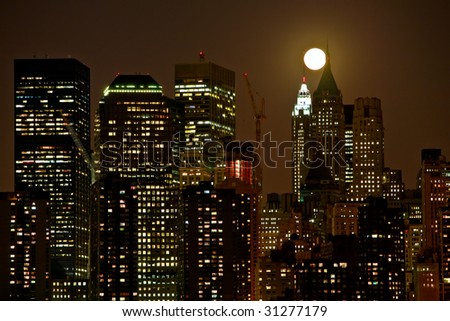 night vision of the top of toll buildings in lower Manhattan during full moon in middle of the night