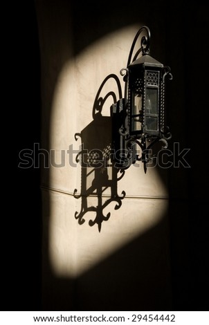 Wrought Iron Wall Lamp and  Shadow