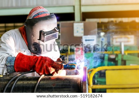 welder Industrial automotive part in factory , welding man working in workshop