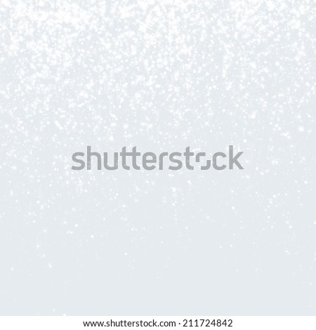 Glittering winter background. White sparkling texture with snowflakes.