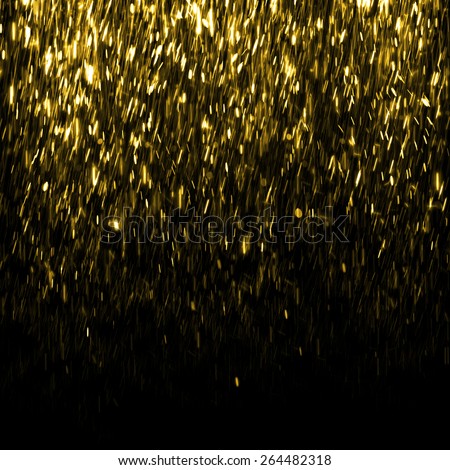 Gold sparkle glitter background. Fire rain background. Sparkling flow background
