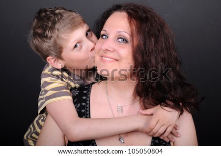 son kissing his mother, isolated in the studio