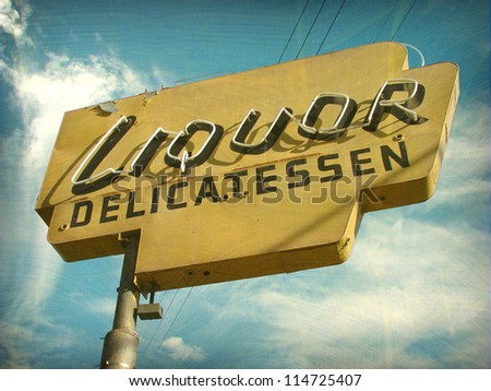 aged and worn vintage photo of liquor store sign