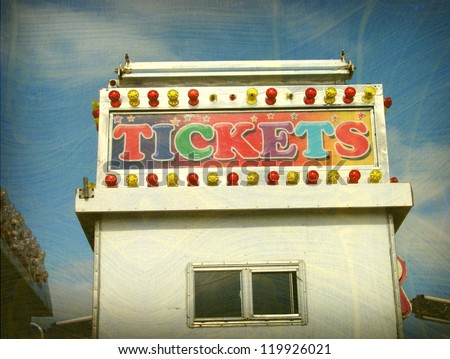 aged and worn vintage photo of carnival ticket booth