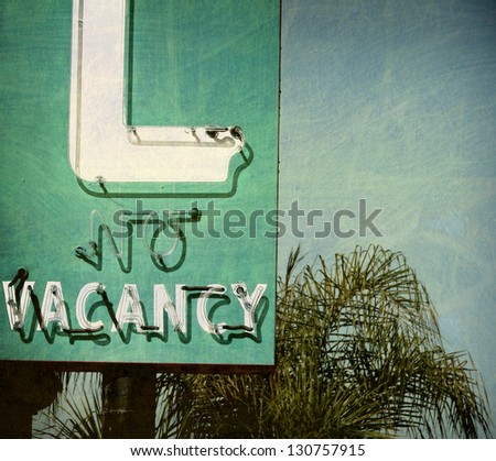 aged and worn vintage no vacancy sign