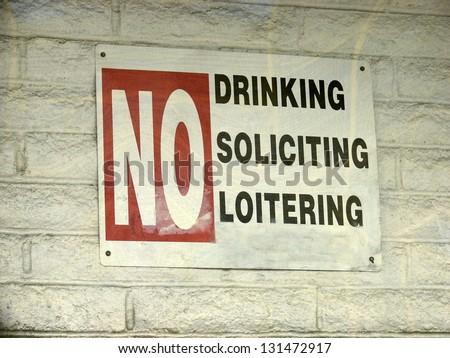 aged and worn vintage photo of no drinking sign