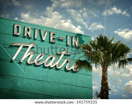 aged and worn vintage photo of drive in theater