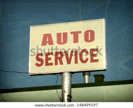 aged and worn vintage photo of auto service sign