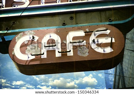 aged and worn vintage neon cafe sign