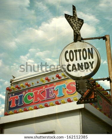 Aged And Worn Vintage Photo Of Carnival Ticket Booth And Cotton Candy Sign