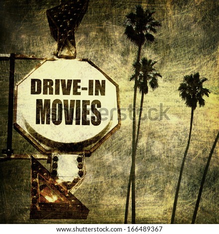 aged and worn vintage photo of drive in movie sign