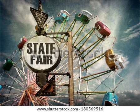 aged and worn vintage photo of state fair sign with ferris wheel