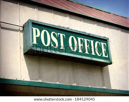 aged and worn vintage photo of post office sign