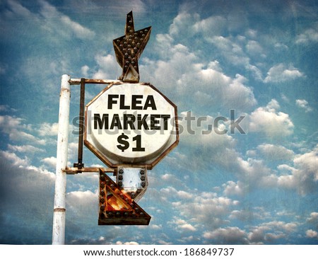 aged and worn vintage photo of flea market sign with cloudy sky