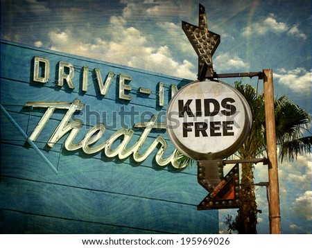 aged and worn vintage photo of  drive in theater kids free sign
