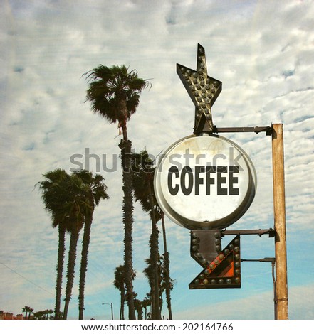 aged and worn vintage photo of coffee sign with palm trees