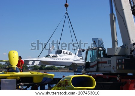 KENNEWICK, WA - JULY 25 : Hydroplane racing boat being lowered by crane during Tri-Cities Water Follies annual event