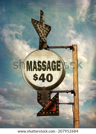 aged and worn vintage photo of massage sign