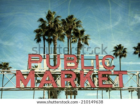 aged and worn vintage photo of neon sign with palm trees