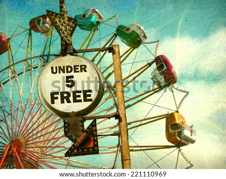 aged and worn vintage photo of 'under five free' sign at carnival