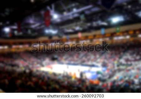 blurred background of basketball crowd in arena