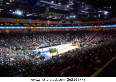blurred background of sports arena crowd