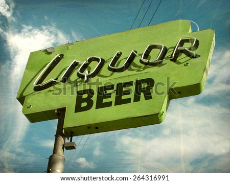 aged and worn vintage photo of liquor and beer sign