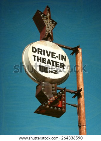 aged and worn vintage photo of drive in theater sign