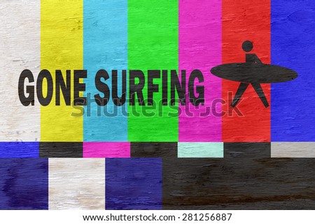 funny gone surfing sign on wood grain texture