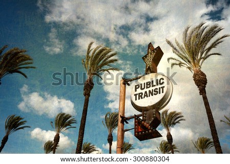 aged and worn vintage photo of public transit sign with palm trees