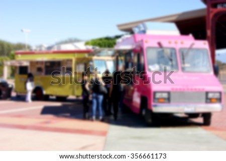 blurred background of people ordering at food truck