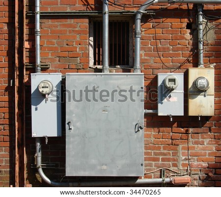 old brick building with electrical boxes