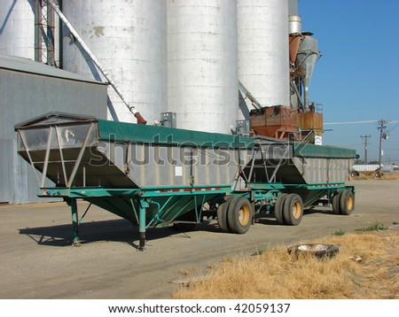 Truck trailer in front of grain elevators