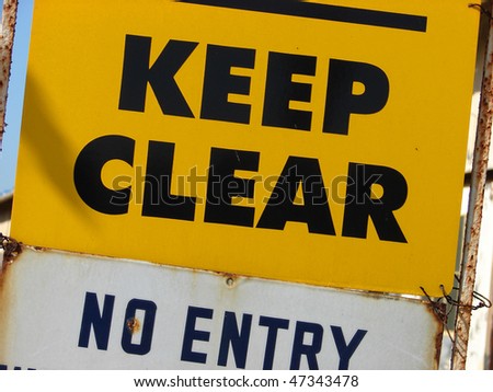 yellow keep clear sign