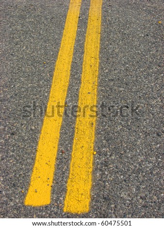 yellow road lines on asphalt road
