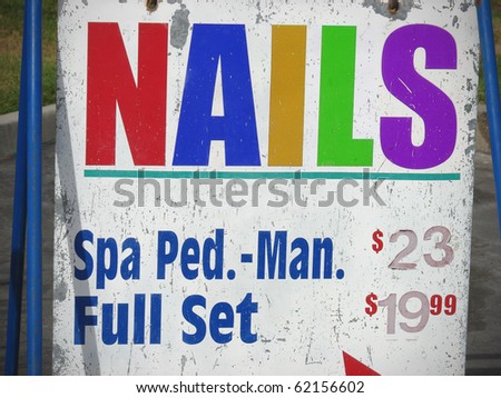 stock photo : colorful nail salon sign with spa prices