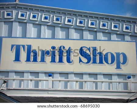 thrift shop sign on building with architectural detail