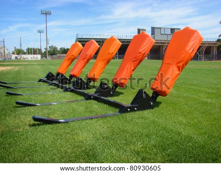 stock-photo--american-football-practice-blocking-sled-80930605.jpg