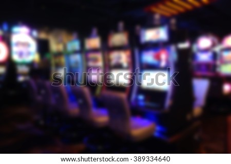 blurred background of slot machines in casino