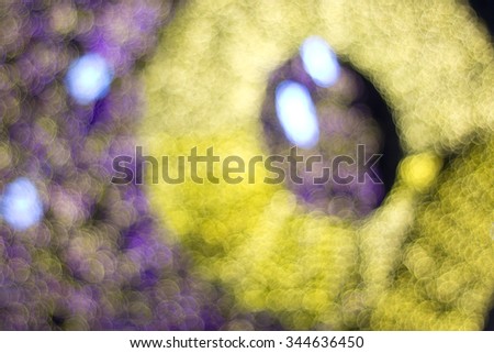 a circle gold and purple bokeh light