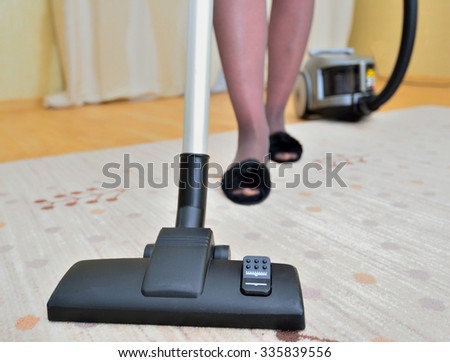a woman cleans light carpet cleaner