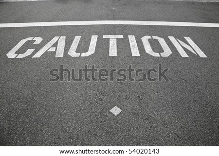 a caution sign in the street indication for cars to watch for pedestrians crossing