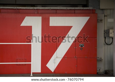 [20-12-2011][FORUM GAME] TRUY TÌM CON SỐ Stock-photo-a-red-japanese-tsunami-watertight-door-in-osaka-bay-area-with-the-number-painted-on-it-76070794