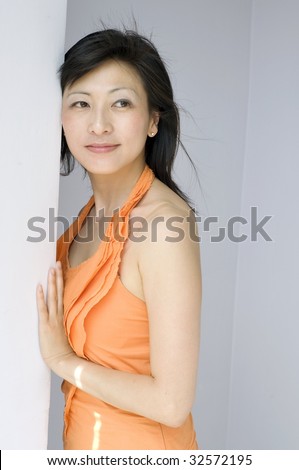 stock photo portrait of young attractive eurasian woman indoor
