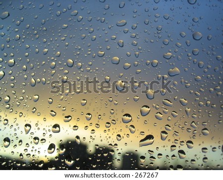 rain drops on the window, sunset in background, stormy clouds behind #3