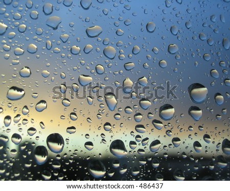 rain drops on the window, sunset in background, stormy clouds behind #2