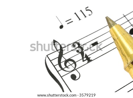extreme close-up of music note and ballpoint pen tip against white background, focus is set on treble clef