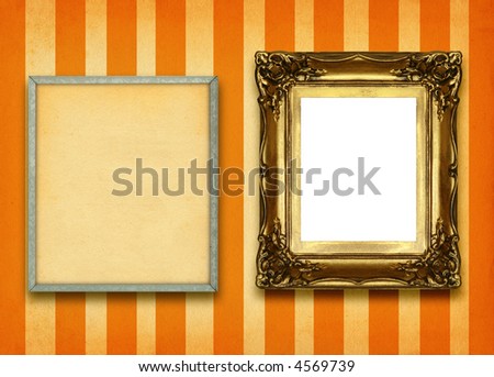 hollow gilded picture frame and empty pinboard against striped wall